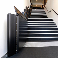 Garaventa Artira platform lift indoors, black.