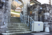 Platform lift at a church entrance on a sloped site.