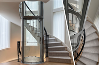 Round Savaria Vuelift glass homelift in the stairwell void of a modern single-family home.