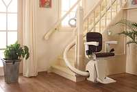 Stairlift SLK overview from the side leather seat curved stairs